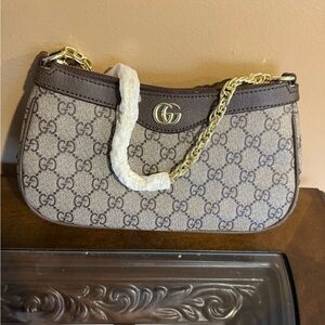 Brown and Gold Shoulder Bag with Iconic Design